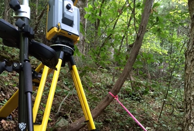 Surveyor at work outdoors
